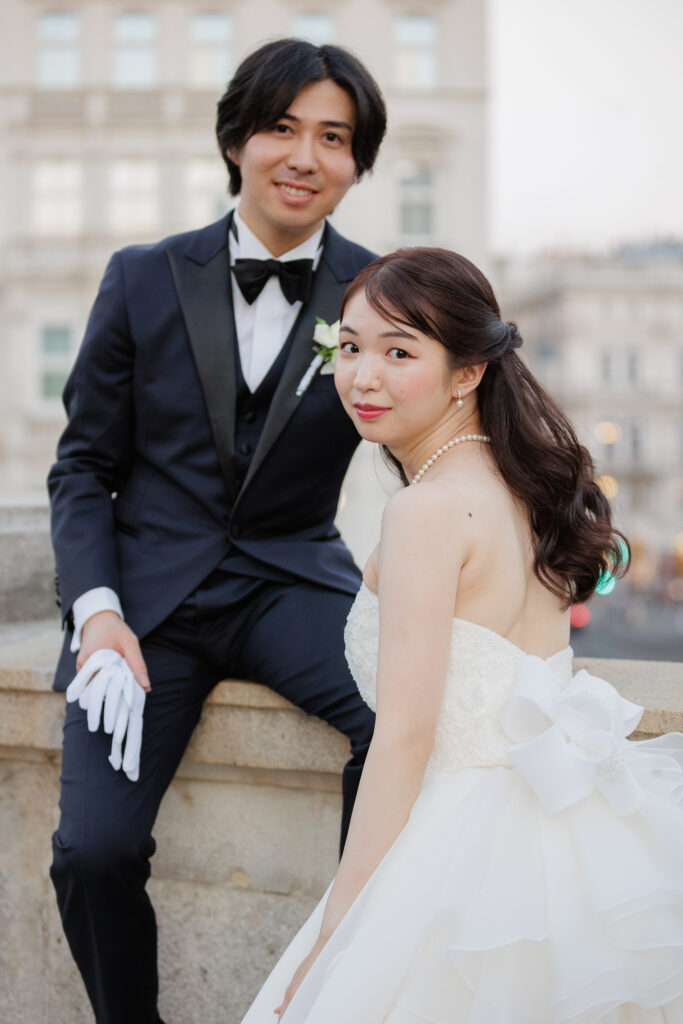 Asian bride and groom posing for wedding photos in Vienna, Austria